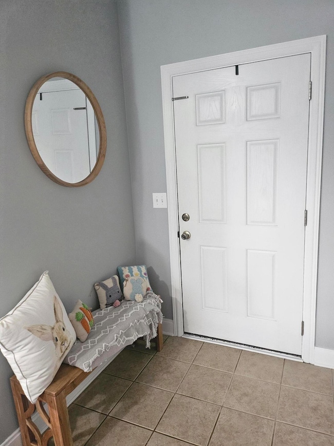 Entry with tile floor
