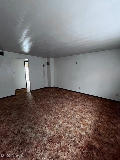 Empty room featuring carpet flooring