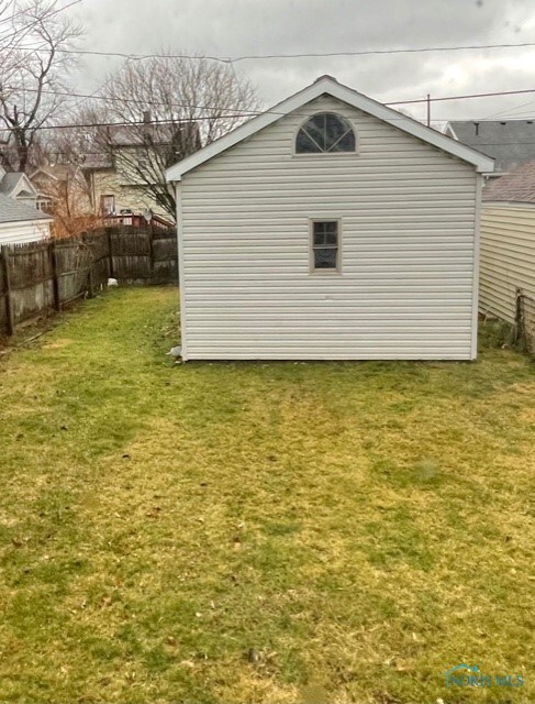 FENCED IN YARD OVERLOOKING GARAGE