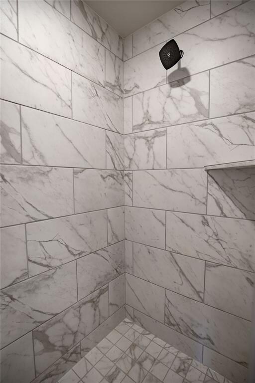 Bathroom with tiled shower
