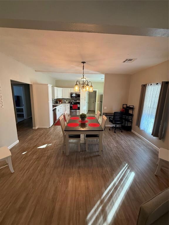 Dining room and a chandelier with kitchen table an