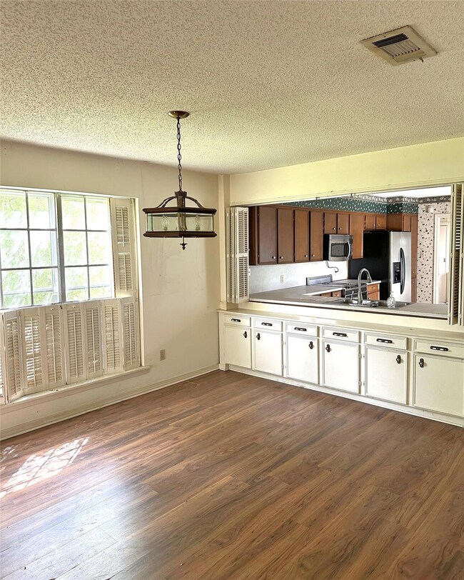 Kitchen with appliances with stainless steel finis