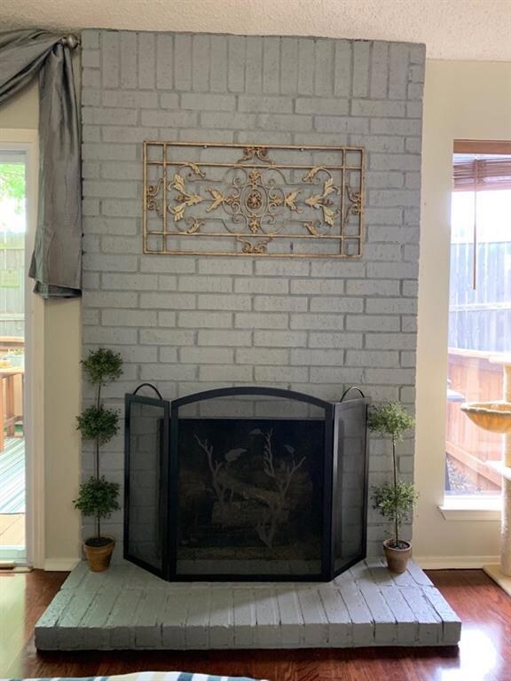 Detailed view of wood finished floors, a brick fi