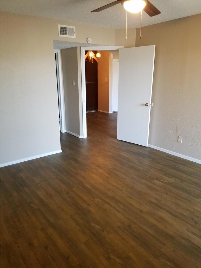 Spare room with visible vents, ceiling fan with no