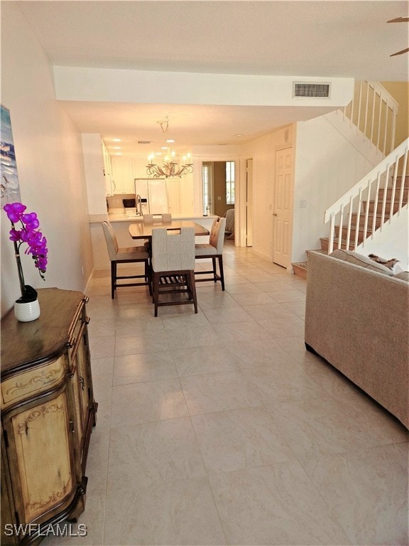 Dining area with a notable chandelier