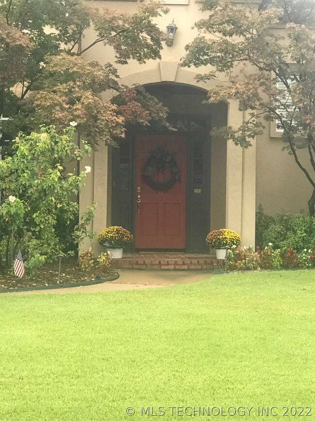 Stucco covered porch. Lovely entrance!