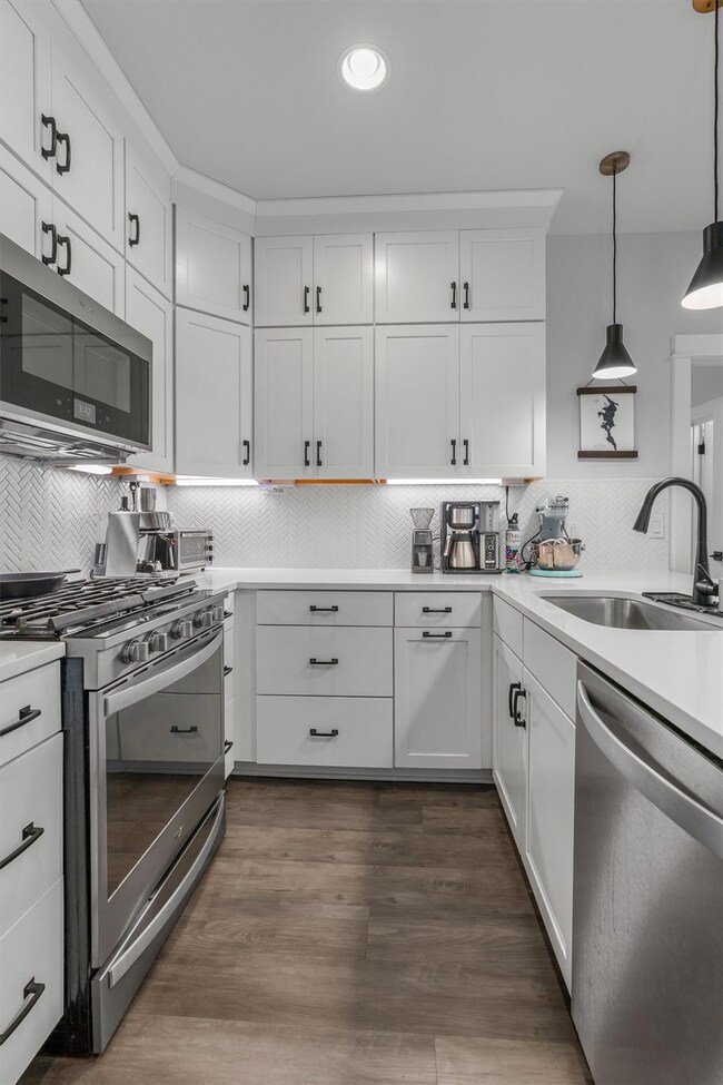 Kitchen featuring appliances with stainless steel