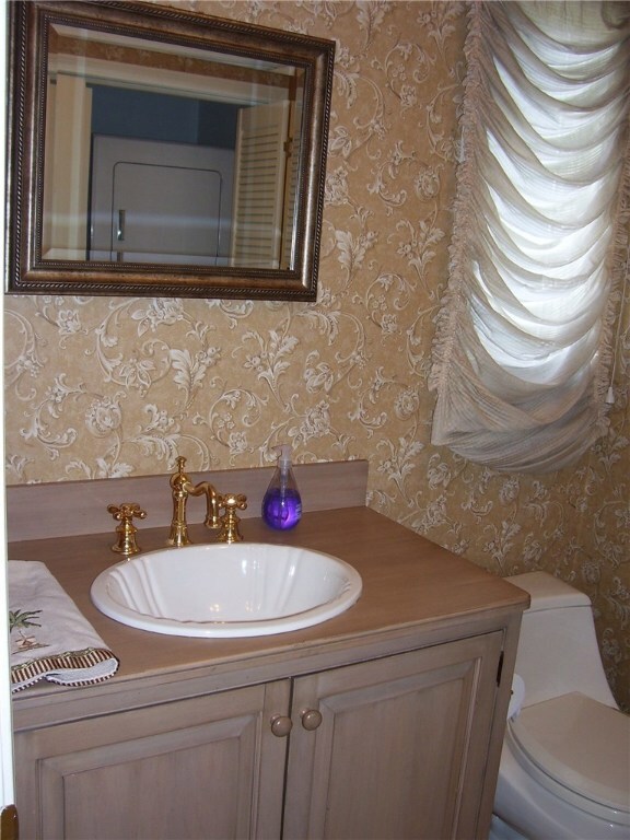 Granite counter in this half bath. New Washer and