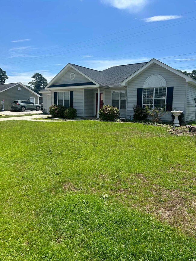 Ranch-style house with a front lawn