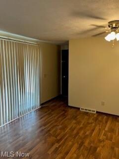 Dining room with ceiling fan / wood-style floors a