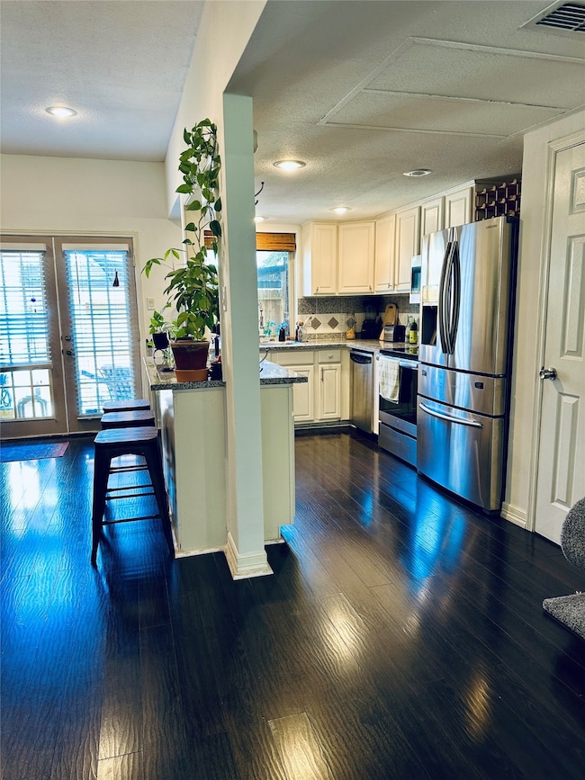 Kitchen open to flex space, dining, & family