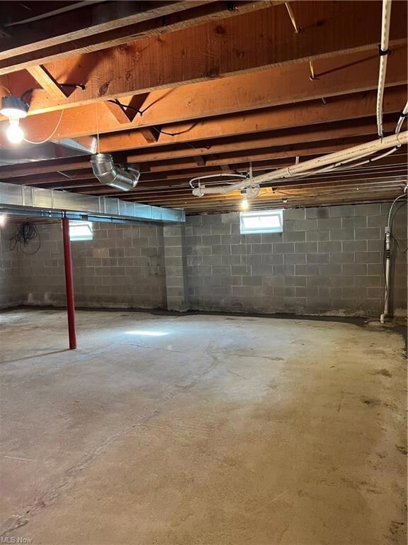 Basement featuring ceiling fan