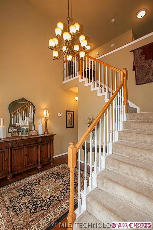 Grand two-story entry.  Massive chandelier.  Drama