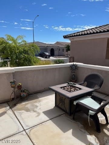 Patio / terrace featuring an outdoor fire pit