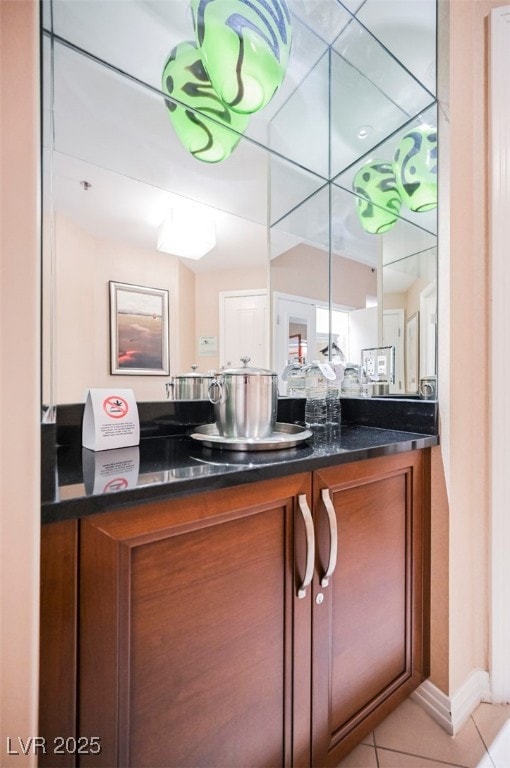 Bathroom featuring vanity and tile patterned floor