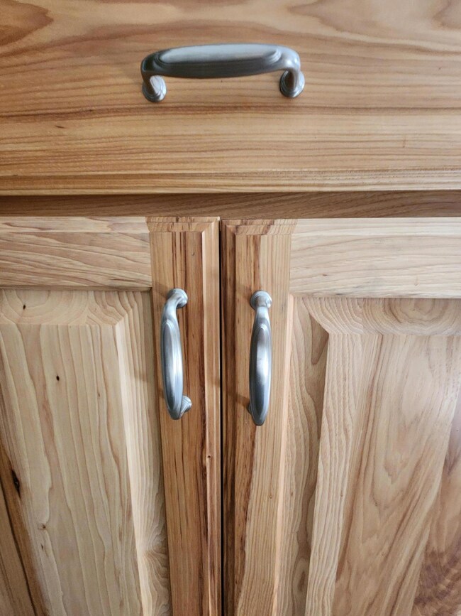 Kitchen cupboards feature upgraded hardware, also.
