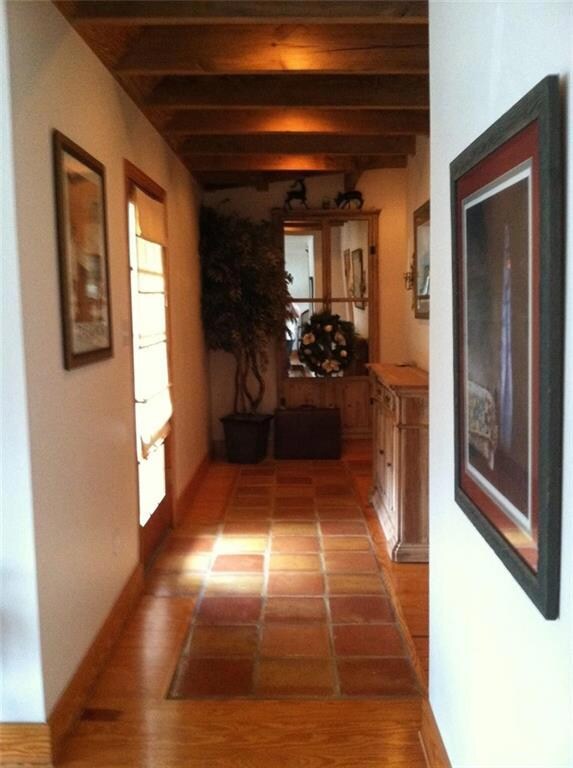 Main entry way foyer with Mexican tile and wood
