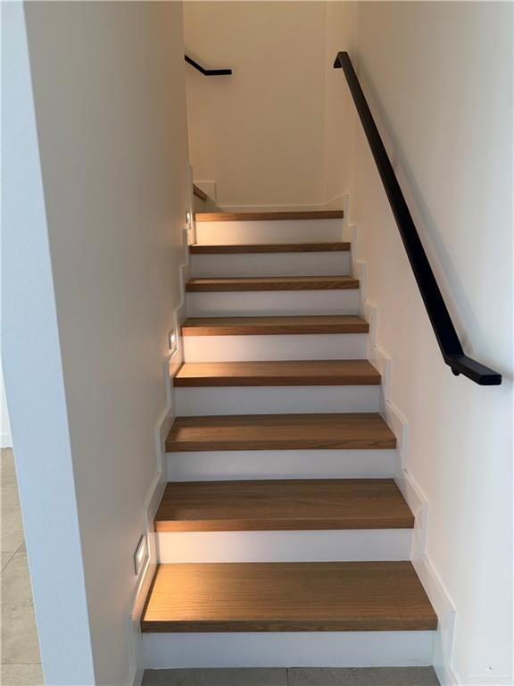 Stairs with tile patterned flooring