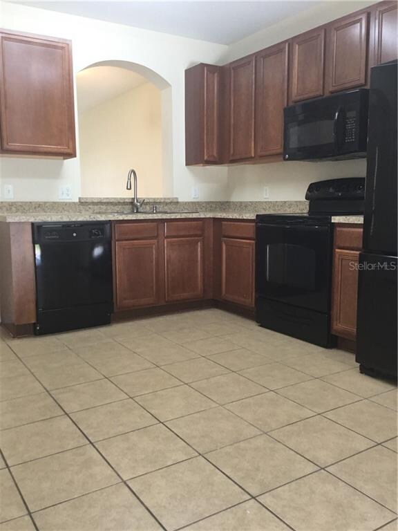 Spacious kitchen open to main living room. Wood ca