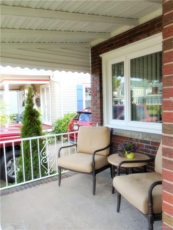 A warm and inviting front porch with newer awning 