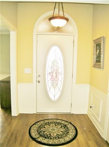 Inviting foyer with decorative lead glass front do