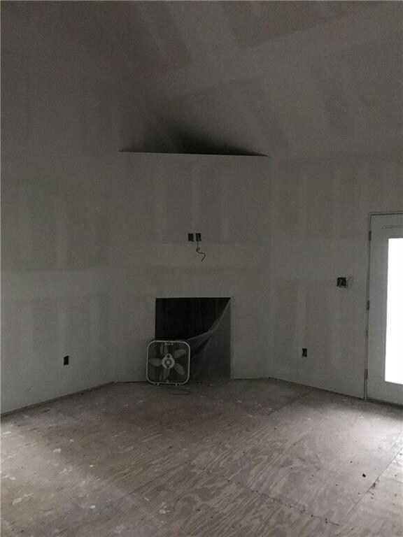 Den with French doors to back porch has a Fireplac
