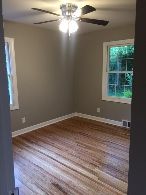 New ceiling fan and newly refinished hardwood floo