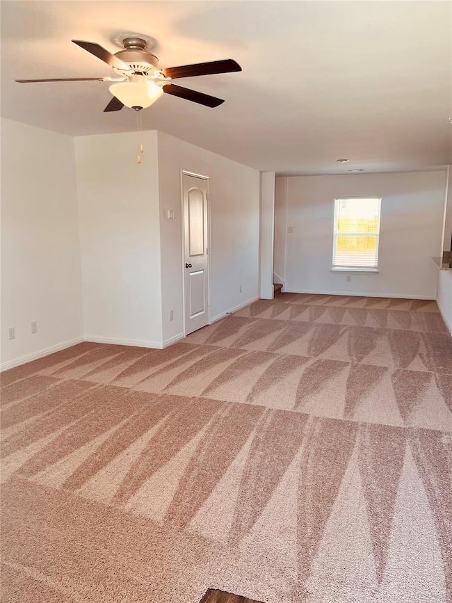 Spare room featuring carpet flooring and ceiling 