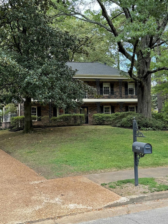 View of front of property with a front yard