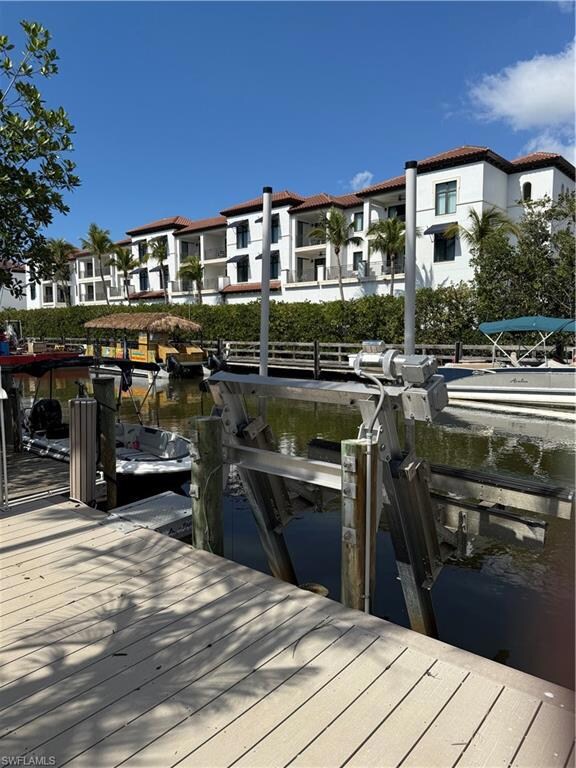 Dock area featuring a water view