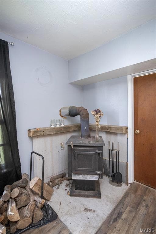 Detailed view of a wood stove and wood finished floors