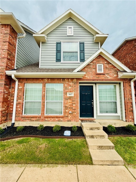 Traditional home with brick siding