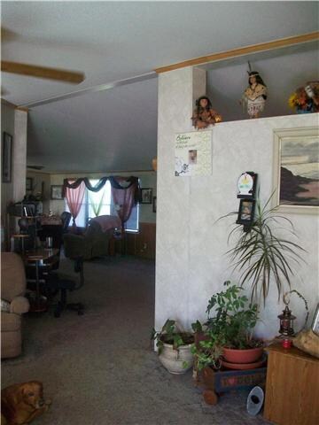 Open living area from living room into the den