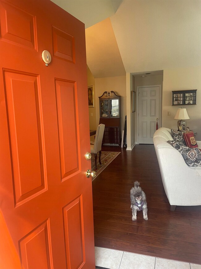 Entryway featuring hardwood / wood-style floors. C