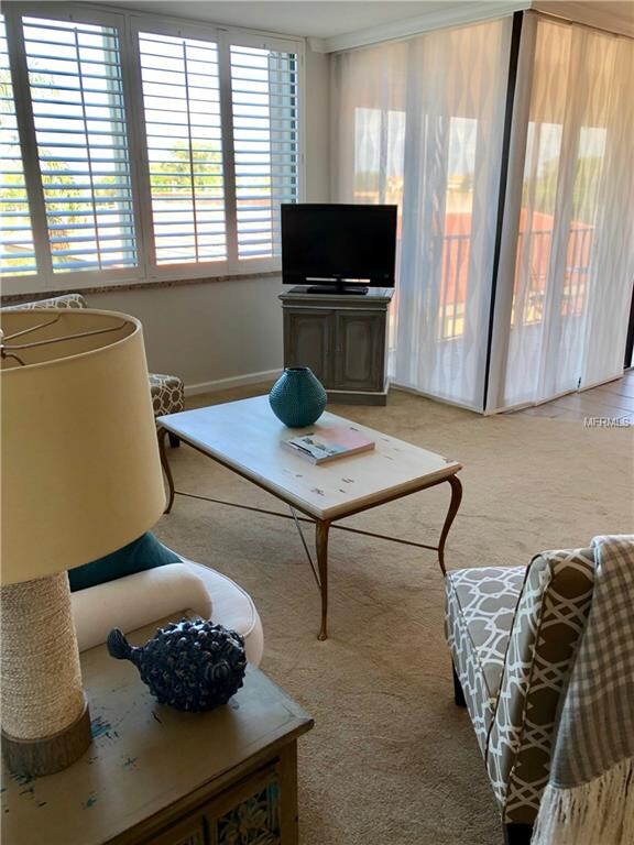 Living room overlooking screened balcony