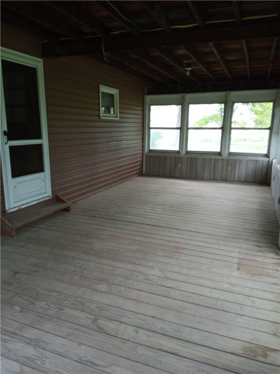 Enclosed porch facing road.  Size 28X12