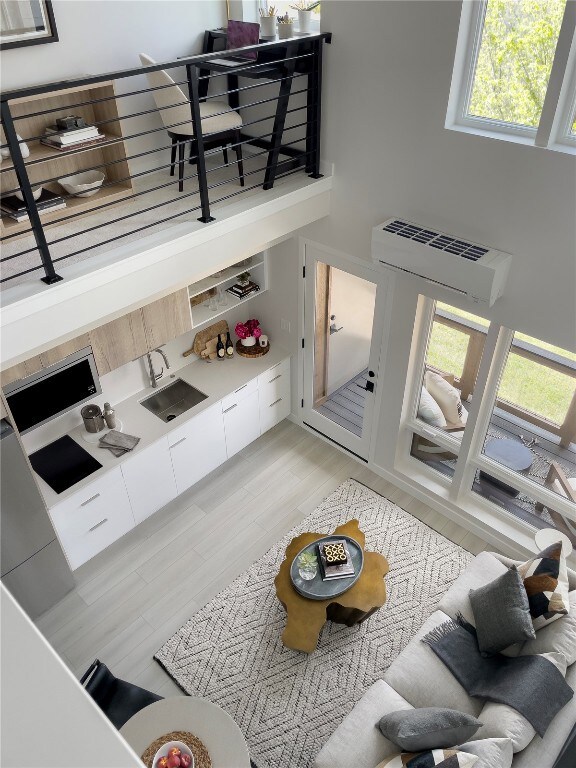 Living area with a towering ceiling