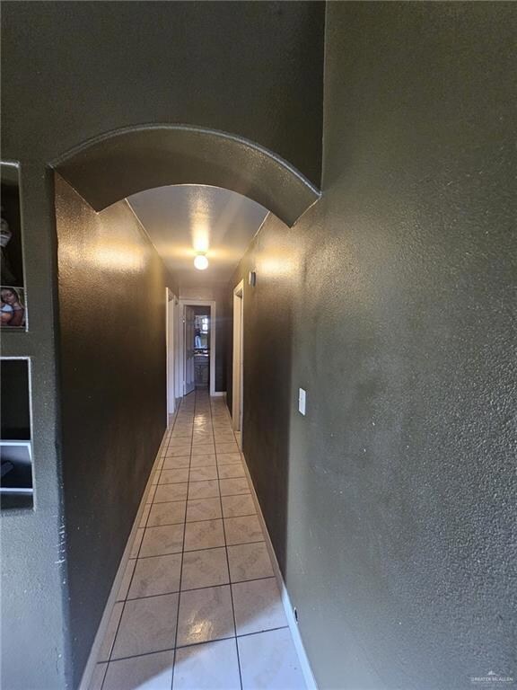 Hall with light tile floors