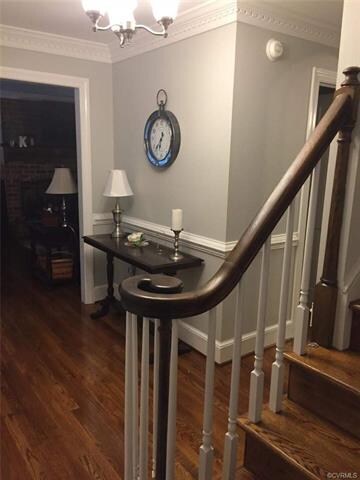 Foyer view showing hardwood floors installed throughout 1st floor (except kitchen)... Entry into family Room at left