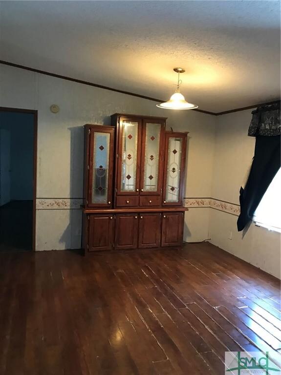 Generous Formal Dining Room with easy access to ki