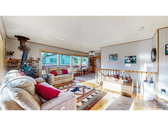 Living room with new windows and wood burning fireplace