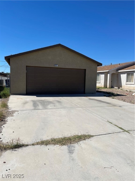 View of front of house featuring stucco siding