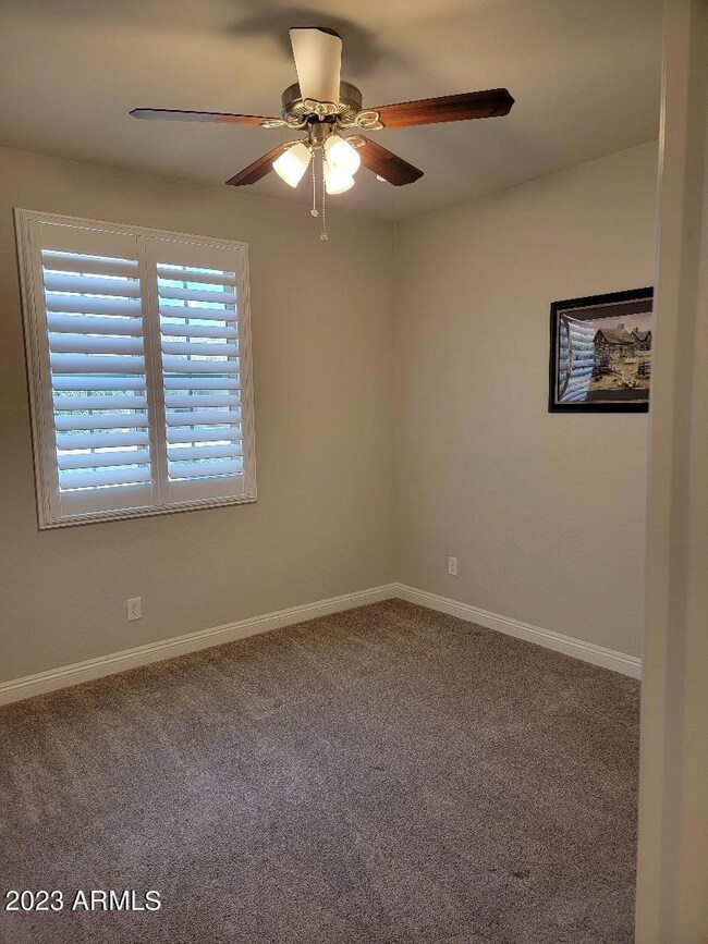 guest bedroom with shutters