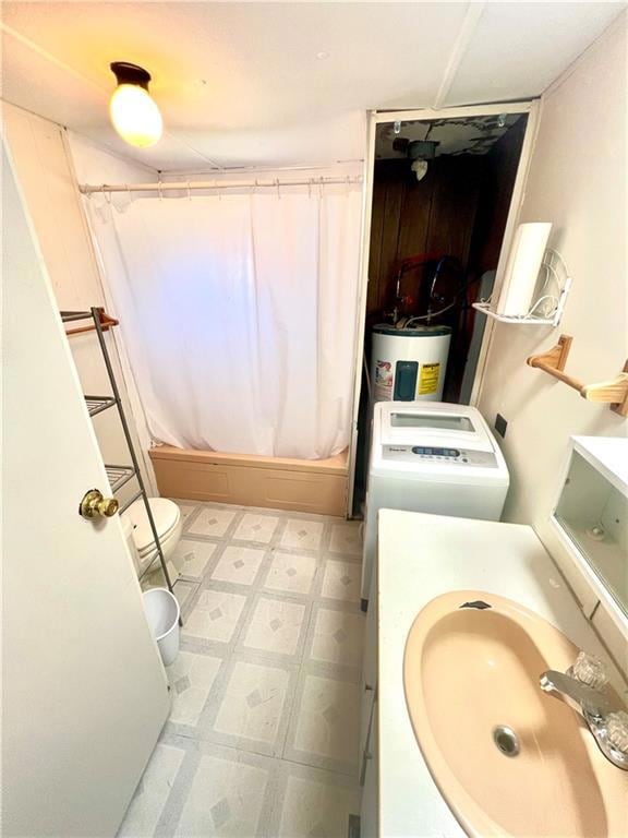 Bathroom featuring electric water heater, vanity, shower / bath combination with curtain, and tile patterned floors