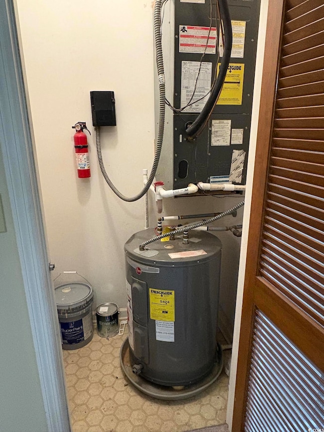 Utility room featuring water heater and HVAC