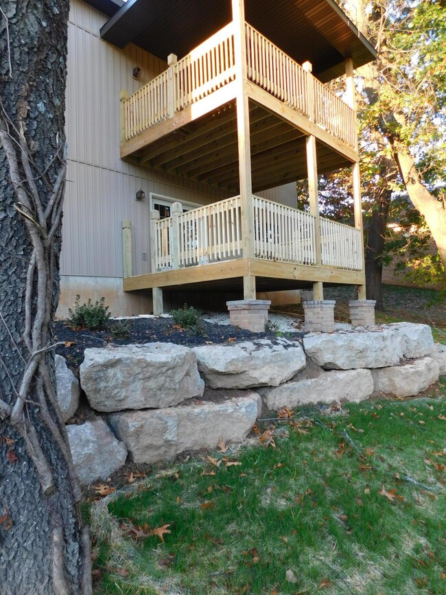 Double deck is landscaped with boulders