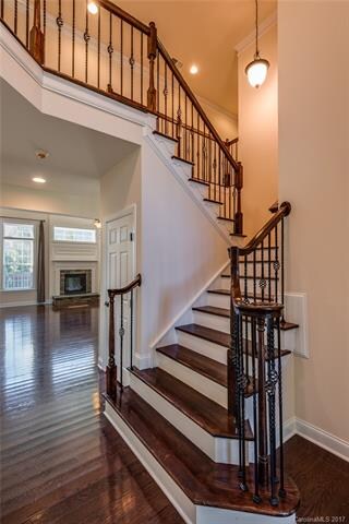 Main floor has dark hardwoods throughout. Staircas