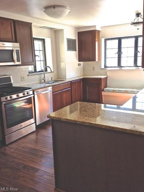 Completely updated kitchen with hardwood floors an