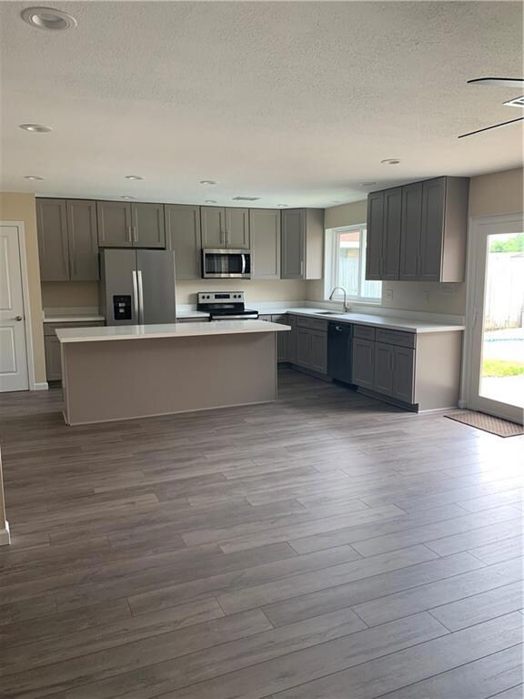 Large open kitchen that overlooks living area and