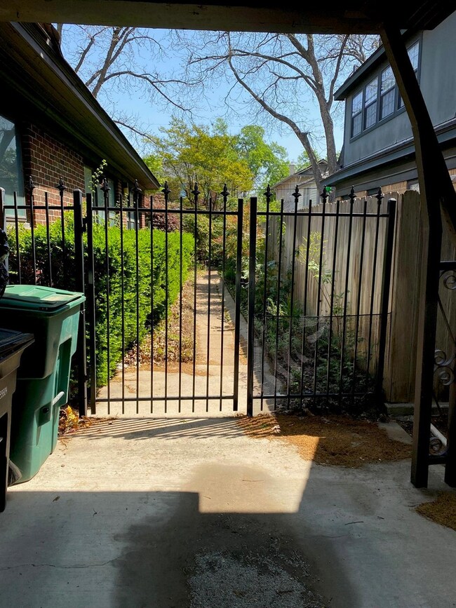 View of gate featuring fence